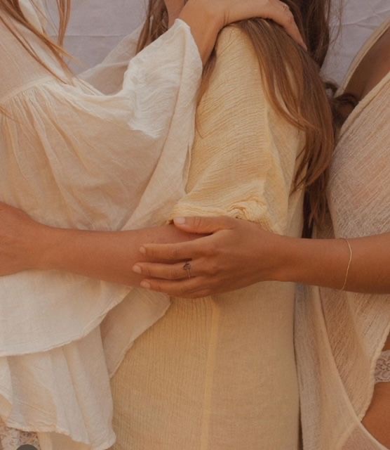 Women in a soft supportive embrace